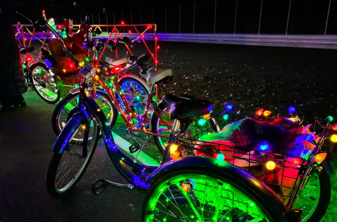 Closeup of Three-Wheel Bicycle Wrapped in Christmas Lights for Winter Wonderland's Bike the Lights Event